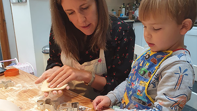 Adult and child making sour dough decorations